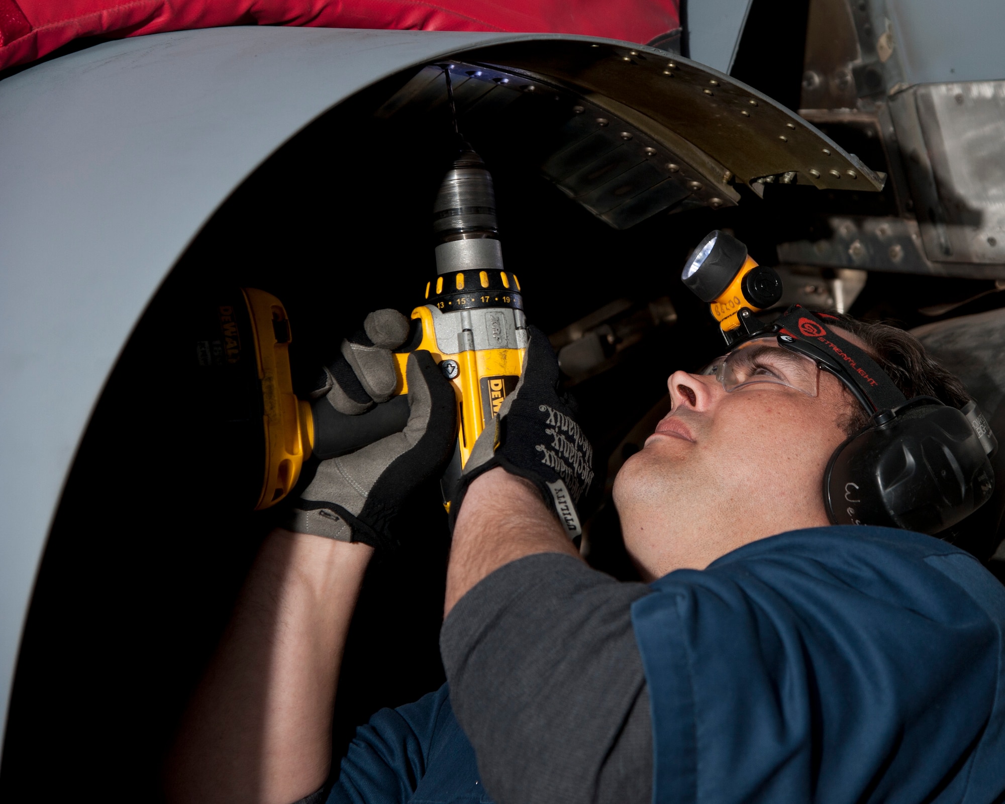 ALTUS AIR FORCE BASE, Okla. -- Shaine West, 97th Maintenance Directorate sheet metal mechanic, removes a screw from the finger seal of the number three engine on a KC-135 Stratotanker, Feb. 12, in an aircraft hangar. West completed the Grow Your Own Mechanic program and is now working full-time for the 97th MX. The GYOM program is an aircraft maintenance technician internship program. It was developed in 1999 under the Student Education Employment Plan in cooperation with the Southwest Technology Center’s Aviation and Aerospace program, providing aerospace jobs to the local area. (U.S. Air Force photo by Senior Airman Kenneth W. Norman / Released)