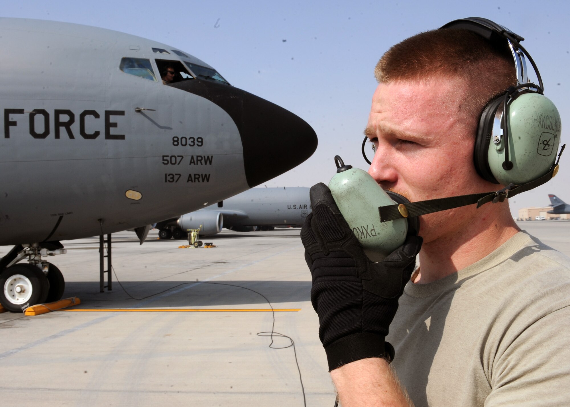 SOUTHWEST ASIA - Airman First Class Jarred Purvis, 340th Aircraft Maintenance Unit electrician, talks to the pilots before a KC-135 taxis from the ramp Feb. 13. He is relaying to the aircrew that engine number four is clear to start. Purvis is deployed from the 911th Air Refueling Squadron at Seymour Johnson Air Force Base, N.C. (U.S. Air Force photo by Senior Airman Joel Mease)