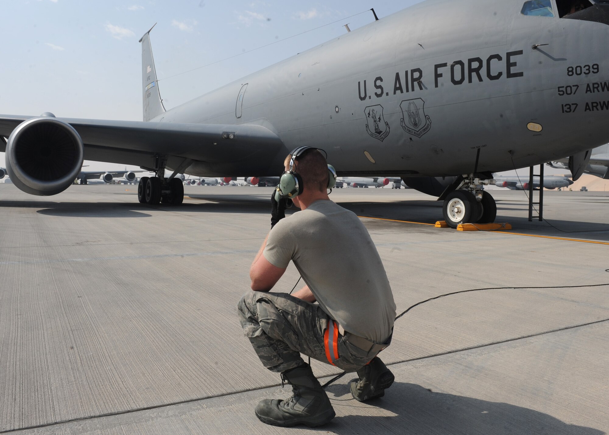 SOUTHWEST ASIA - Airman First Class Jarred Purvis, 340th Aircraft Maintenance Unit electrician, watches an engine run before a KC-135 taxis from the ramp Feb. 13. Purvis is clearing flight controls and engines for operations to ensure safety of passing vehicles and maintenance technicians. Purvis is deployed from the 911th Air Refueling Squadron at Seymour Johnson Air Force Base, N.C. (U.S. Air Force photo by Senior Airman Joel Mease)