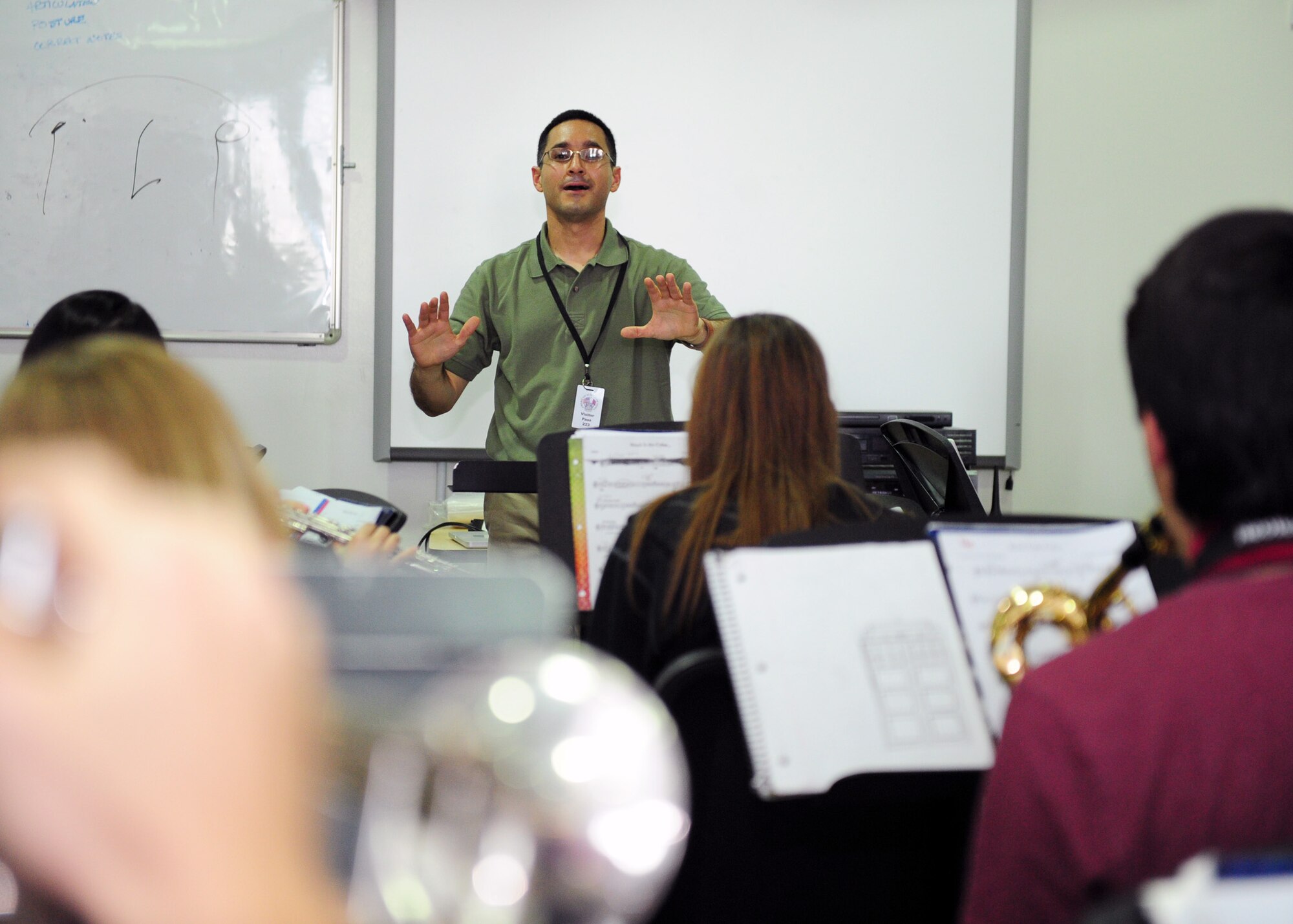SOUTHWEST ASIA – 1st Lt. Rafael Toro Quinones, Air Force Central Command Band officer in charge, gives feedback to students during a music class he taught at a local school Feb. 6. The school has a long standing relationship with the band, and asked Toro Quinones to provide a different musical perspective for the students. (U.S. Air Force photo/Master Sgt. Brendan Kavanaugh)