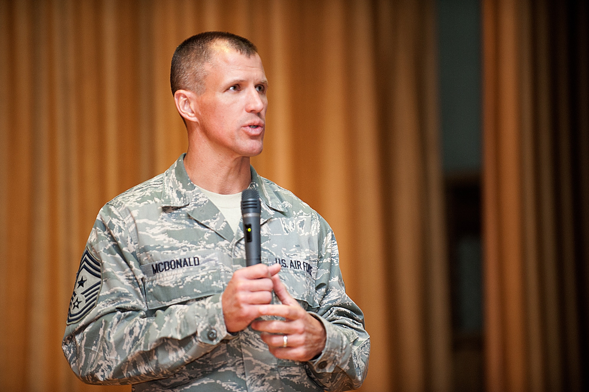 Command Chief Master Sergeant of Pacific Air Forces Chief Master Sgt. Steve McDonald addresses Yokota Air Base’s enlisted force Feb. 8, 2013.  He visited the air base to hear from Airmen and view the professional airlift mission and operations at Yokota. (U.S. Air Force photo by Airman 1st Class Meagan Schutter)