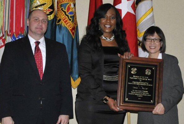 Tonju Butler(center) contracting officer in the U.S. Army Engineering and Support Center, Huntsville's Contracting Directorate poses with Mr. Kim Denver, Deputy Assistant Secretary of the Army for Procurement and the Hon. Ms. Heidi Shyu, Assistant Secretary of the Army for Acquisition, Logistics and Technology during the Secretary of the Army Awards for Excellence in Contracting ceremony Jan. 28.