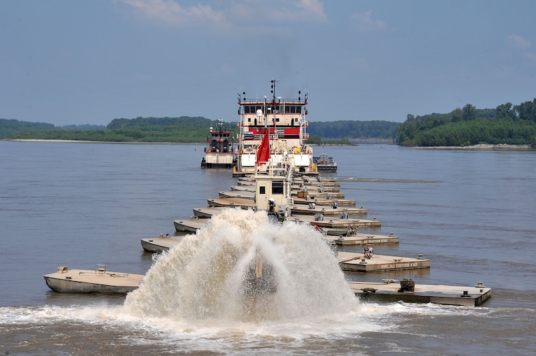 The Hurley in action, showing the pipeline that carries and deposits dredged sediment out of the navigation channel.