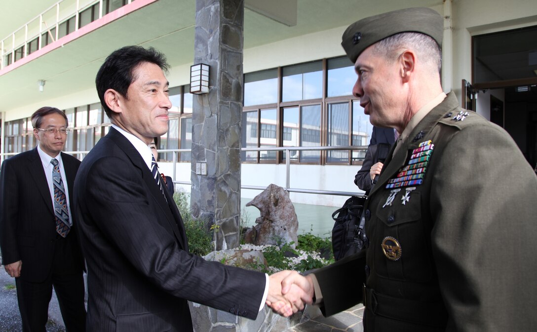 Fumio Kishida and Maj. Gen. Peter J. Talleri shake hands after a meeting on Camp Foster Feb. 16. The purpose of the visit was to conduct a courtesy call with the acting Okinawa Area Coordinator and to tour Marine Corps Installations. Talleri is the commanding general of Marine Corps Installations Pacific and acting Okinawa Area Coordinator. Kishida is the Minister for Foreign Affairs of the Government of Japan.
