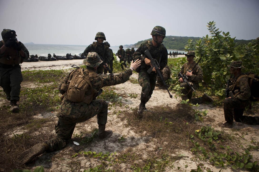 Marines with Company B., Battalion Landing Team 1st Battalion, 5th Marine Regiment, 31st Marine Expeditionary Unit, count their Royal Thai Marine counterparts to ensure accountability of the raid force during a bilateral boat raid as a part of exercise Cobra Gold 2013 here, Feb. 15. Cobra Gold is an annual exercise that includes numerous multilateral events ranging from amphibious assaults to non-combatant evacuation operations. The training aims to improve interoperability between the United States, the Kingdom of Thailand, and many other participating countries. The 31st MEU is the only continuously forward-deployed MEU and is the Marine Corps’ force in readiness in the Asia-Pacific region.