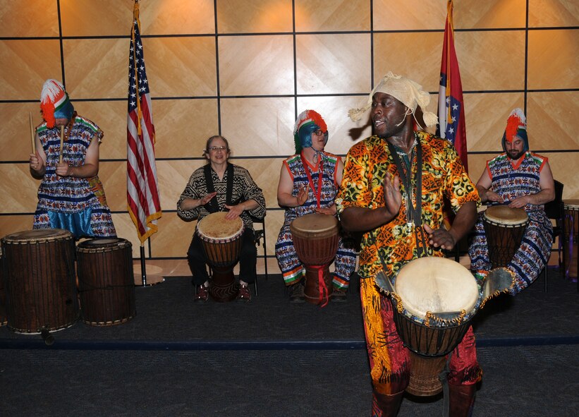 Members of Afrique Aya, a troupe of drummers and dancers, perform at the 188th Fighter Wing during a Black History Month celebration held at the Hugh B. Correll Headquarters building Feb. 3 during a Unit Training Assembly. The group performed rhythms inspired by the music and culture of West Africa. (National Guard photo by Airman 1st Class Cody Martin/188th Fighter Wing Public Affairs)