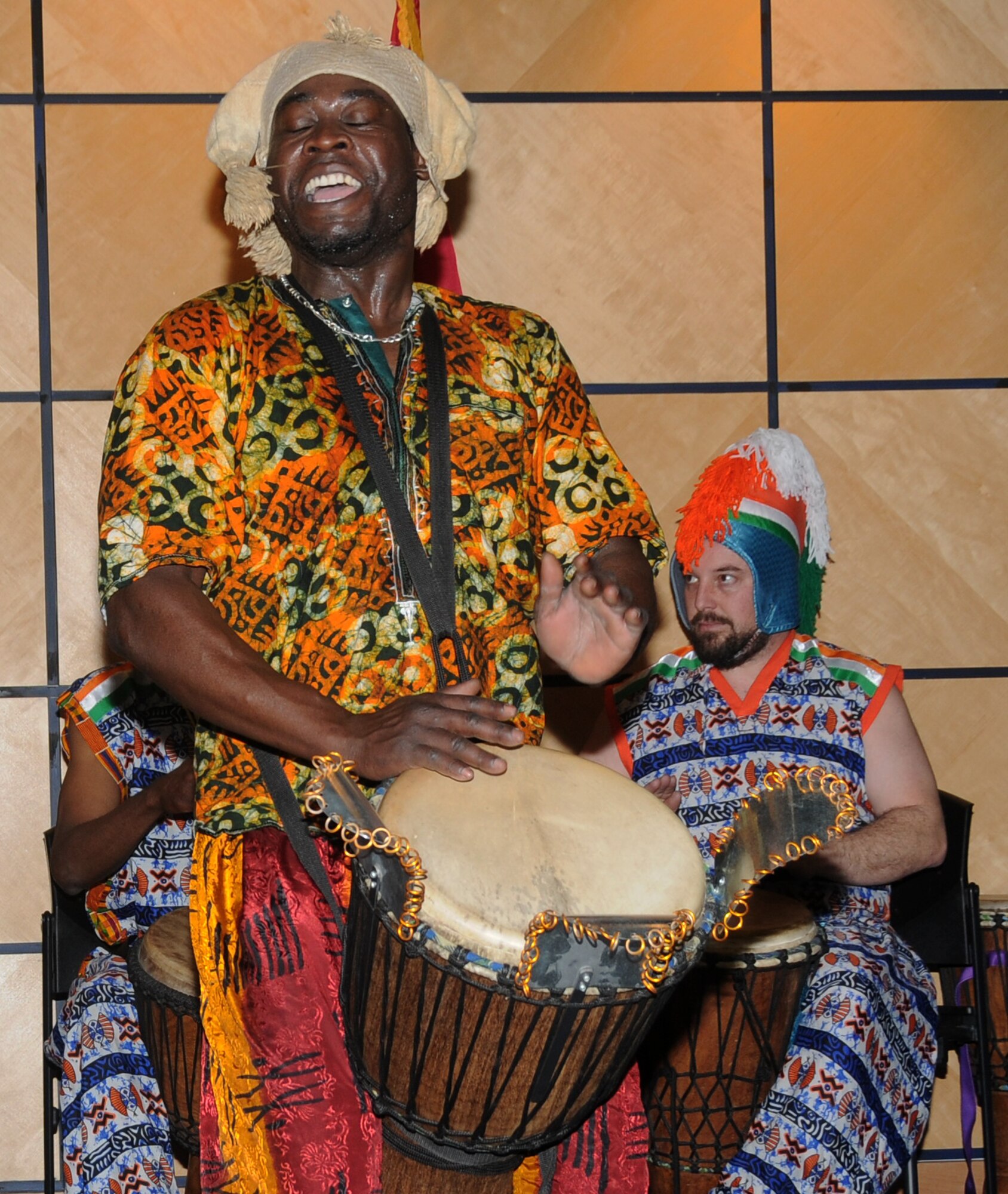 Members of Afrique Aya, a troupe of drummers and dancers, perform at the 188th Fighter Wing during a Black History Month celebration held at the Hugh B. Correll Headquarters building Feb. 3 during a Unit Training Assembly. The group performed rhythms inspired by the music and culture of West Africa. (National Guard photo by Airman 1st Class Cody Martin/188th Fighter Wing Public Affairs)