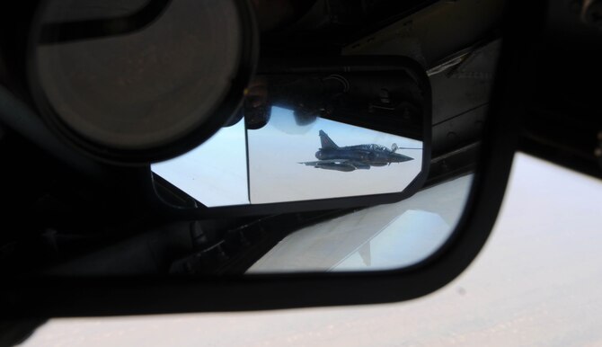 A French Mirage 2000 refuels from a KC-135 Stratotanker from the 100th Air
Refueling Wing, RAF Mildenhall, England, over Africa Feb. 2, 2013. Several mirrors allow the KC-135 boom operator to see aircraft refueling from drogue baskets dragged behind the Stratotanker's wingtips. Tanker crews from RAF Mildenhall, designated the 351st Expeditionary Air Refueling Squadron, deployed to a base in southwest Europe in January to support French operations in Mali. (U.S. Air Force photo by Staff Sgt. Austin M. May)