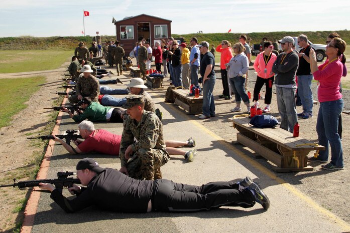 Teachers and counselors from Recruiting Stations Twin Cities and Kansas City shoot live rounds during an educators workshop Jan. 31. This was the first time several educators had ever fired a weapon. For additional imagery from the event, visit www.facebook.com/rstwincities.