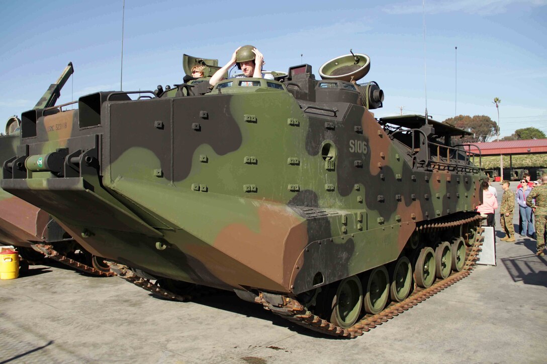 Teachers and counselors from Recruiting Station Twin Cities and Kansas City inspect various types of vehicles at the Assault Amphibian School Battalion Jan. 31. Educators were also able to interview students and staff members currently stationed at the schoolhouse. For additional imagery from the event, visit www.facebook.com/rstwincities.