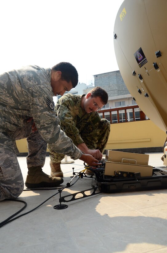 U.S. service members with the Joint Communication Support Center, attached to the U.S. Army Pacific Contingency Command Post, work on a communications satellite dish Feb. 16 in Chiang Mai province, Kingdom of Thailand, during exercise Cobra Gold 2013. The CCP plays a significant role in the daily operations of the staff planning exercise during CG 13. U.S. involvement in CG 13 demonstrates commitment to building military-to-military interoperability with participating nations and to supporting peace and stability in the region.