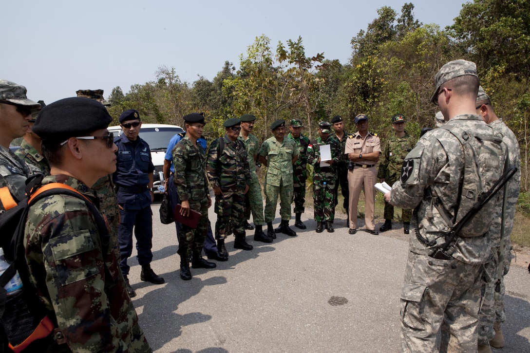 Multinational service members participating in a senior enlisted team-building activity receive a range brief prior to touring the live-fire range in Phitsanulok province, Kingdom of Thailand, Feb. 12 during exercise Cobra Gold 2013. The two-day seminar allowed attendees to share past experiences, relate training styles, and offer advice to one another in a shared learning environment. Exercise Cobra Gold is the largest multinational exercise in the Asia-Pacific region and provides Thailand, the U.S., Singapore, Japan, Republic of Korea, Indonesia and Malaysia an opportunity to maintain relationships and enhance interoperability.