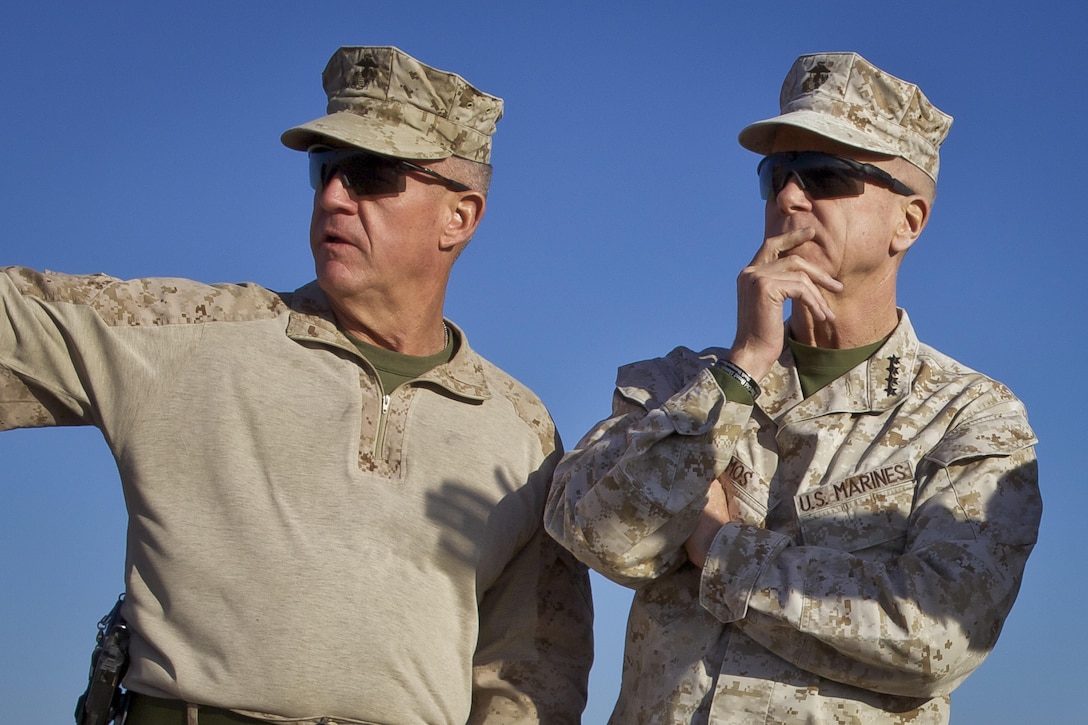 The 35th commandant of the Marine Corps, General James F. Amos, visits with Maj. Gen. Charles M. Gurganus, commanding general, Regional Command (Southwest), during a tour of Camp Leatherneck, Helmand Province, Afghanistan, Feb. 9, 2013. (U.S. Marine Corps photo by Sgt. Mallory S. VanderSchans)(RELEASED)
