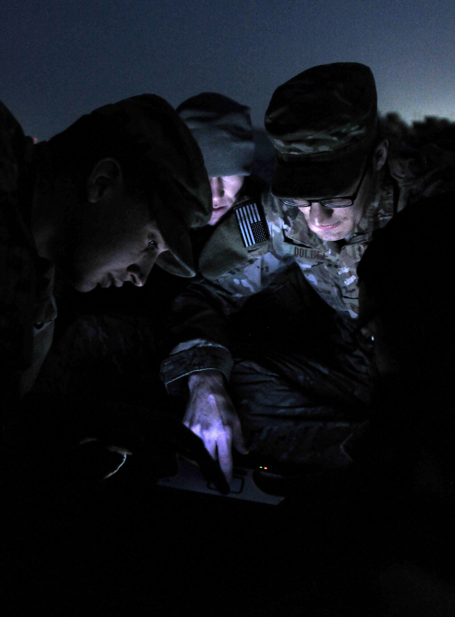 Staff Sgt. Craig Ritter, 1st Lt. Joshua Loomis, Tech. Sgt. John Dolbee, and Staff Sgt. Ben DeSantiago, 755th Expeditionary Security Forces Squadron Reaper team trackers, monitor enemy movement and detection sensors at Bagram Airfield, Afghanistan, Feb. 14, 2013. The tracker team members are all deployed from the 822nd Base Defense Squadron, Moody Air Force Base, Ga. (U.S. Air Force photo/Senior Airman Chris Willis)