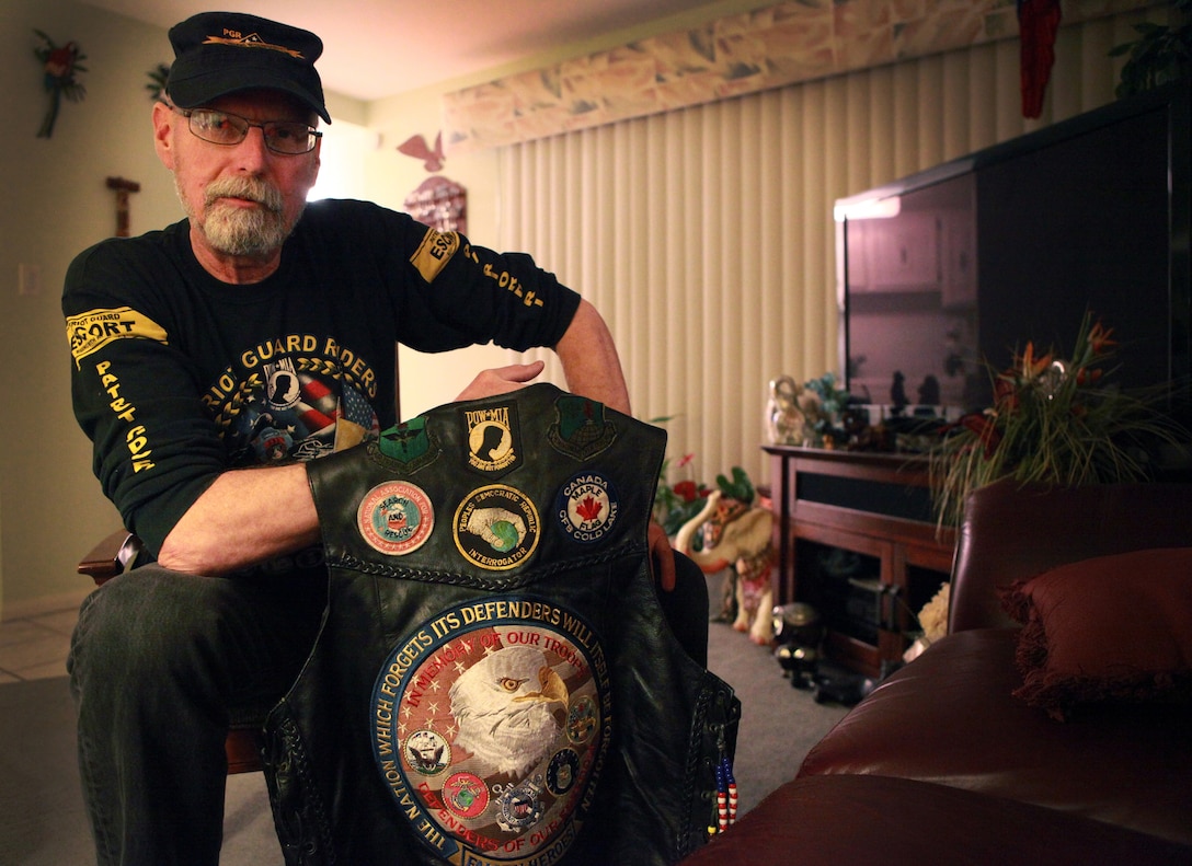 Charles Johnson, a 64-year-old war veteran and a native of Sylmar, Calif., displays his riding vest. Johnson participates in several Patriotic Guard missions a month, including homecomings, memorials, and departures for service members and veterans. 