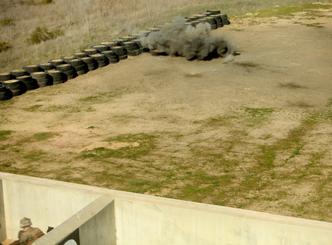 Marines with 7th Engineer Support Battalion, 1st Marine Logistics Group, Alpha Company train with live grenades during a training exercise, Thursday, Feb. 14, 2013 on Range 202, here. The Marines conducted grenade training to remain proficient in the skill. Marines conducted several practice runs before training with live grenades. Grenade training is essential for mission readiness. The company is set to deploy later this year.
