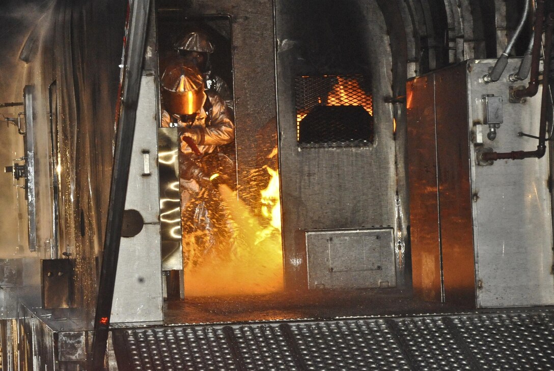 Aircraft Rescue Fire Fighting Marines attempt to put out a fire during a fire training evolution at the Marine Corps Air Facility aboard Quantico on Feb. 12. The Marines go through this type of training at least once a month. 