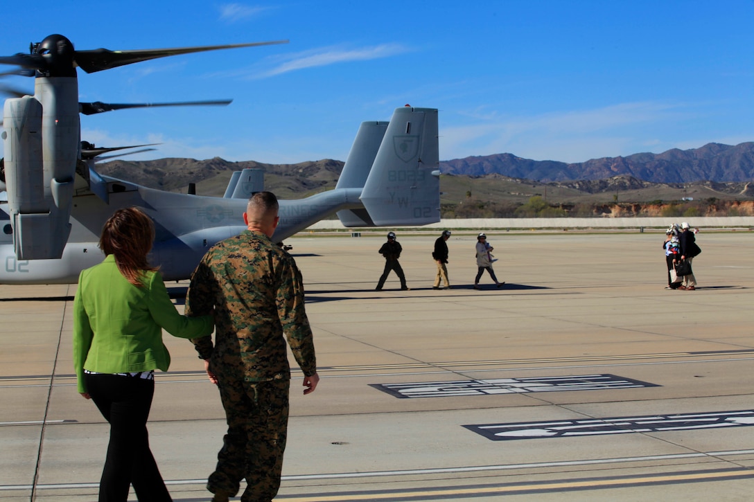 Brig. Gen. Vincent A. Coglianese, base commanding general and regional authority for five military installations in the Southwestern United States, and his wife, walk to greet the Congressional Delegation Miller during their visit to the base, Feb. 16.