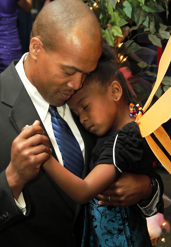 Gunnery Sgt. Cecil Melton dances with his 6-year-old daughter, Nijah, during the Combat Center’s Father Daughter Dance Feb. 8 at Building 1707. This is the first time Nijah went to a dance with her father. 