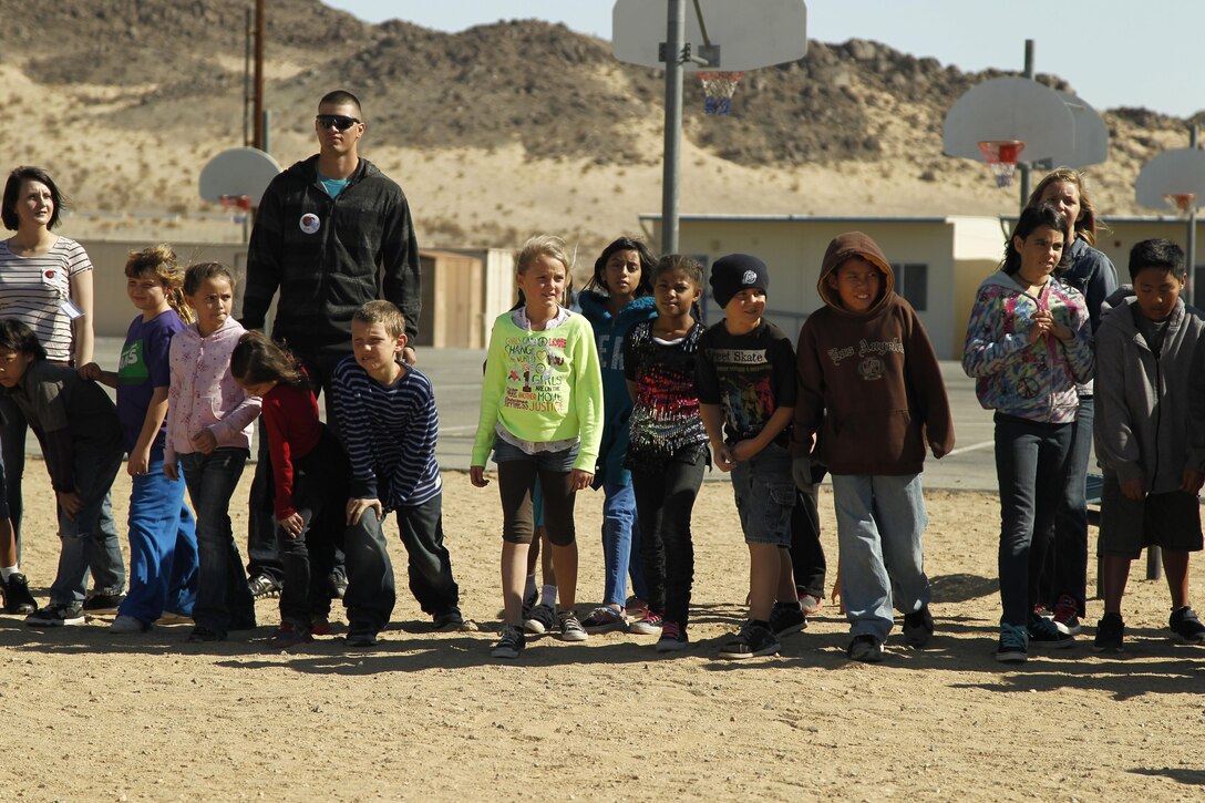 Marines with MCCES line up with 4th graders of Condor Elementary School  before joining them on a one-mile run, Feb. 6, 2013.