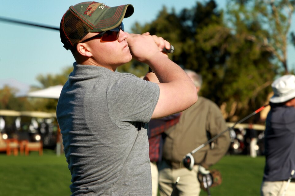 “Redneck 24/7 hat”At the beginning of the day, Redneck 24/7 Hat looked like he was an inexperienced golfer. He powered through his swings at the driving range. He threw more power into his swing than Rocky hitting frozen slabs of meat. While most Marines and sailors sported semi-casual golf attire, Redneck 24/7 Hat wore cargo shorts, Nike running shoes with an orange sole and a grey polo.Unlike most others golfing, he had his pocket knife tucked into his left pocket. Who knows why. Maybe he felt like cutting a few blades of grass away from his golf ball while he was in the rough, who knows.He actually played pretty well. It goes to show you can’t really tell a golfer by the way he dresses himself. Though, in most cases, you can.