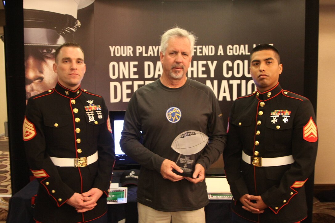 SSgt Sparks and Sgt Alviar pose with Coach Perenon from Mt Eden High School, during the Glazier Clinic in Concord, CA on Feb 9.  Coach Perenon is the recipient of the Semper Fi Coach Award for the San Francisco Glazier clinic.