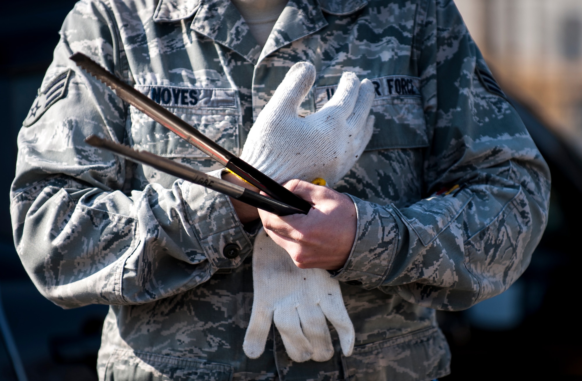 MIZUHO-TOWN, Japan -- An Airman prepares to remove trash from roads and streets of the local community of Mizuho-town, Japan, Feb. 14, 2013. Airmen from Yokota Air Base, Japan, often find ways to provide community services such as this monthly cleanup formed by the 374th Logistical Readiness Squadron. (U.S. Air Force photo by Senior Airman Cody H. Ramirez)