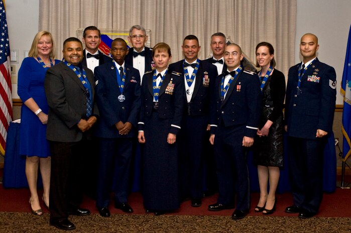 The 99th Air Base Wing annual award winners for 2012 are Civilian Category I, Sara Ermer, 99th Medical Group; Civilian Category II, Gerado Fonseca, 99th Mission Support Group; Civilian Category III, Stephen Blevins, 799th Air Base Group; Civilian Category IV, Julie Swan, 99th MSG; Field Grade Officer, Maj. Dana Longo, 99th MDG; Company Grade Officer, Capt. Sang Ngo, 99th MDG; First Sergeant, Master Sgt. Brandy Walker, 99th MSG; Senior Noncommissioned Officer, Master Sgt. Ronald Killen, 99th MSG; NCO, Tech. Sgt. Steve Kim, 99th Air Base Wing; and Airman, Senior Airman Isaac Ndungu, 99th MSG, pose for a group photo during the annual awards banquet Feb. 15 at the Club on Nellis Air Force Base, Nev.  The awards recognize Airmen and civilians for exceptional performance in the workplace and outstanding contributions to the local community during the past year. (U.S. Air Force photo by Senior Airman Matthew Lancaster)