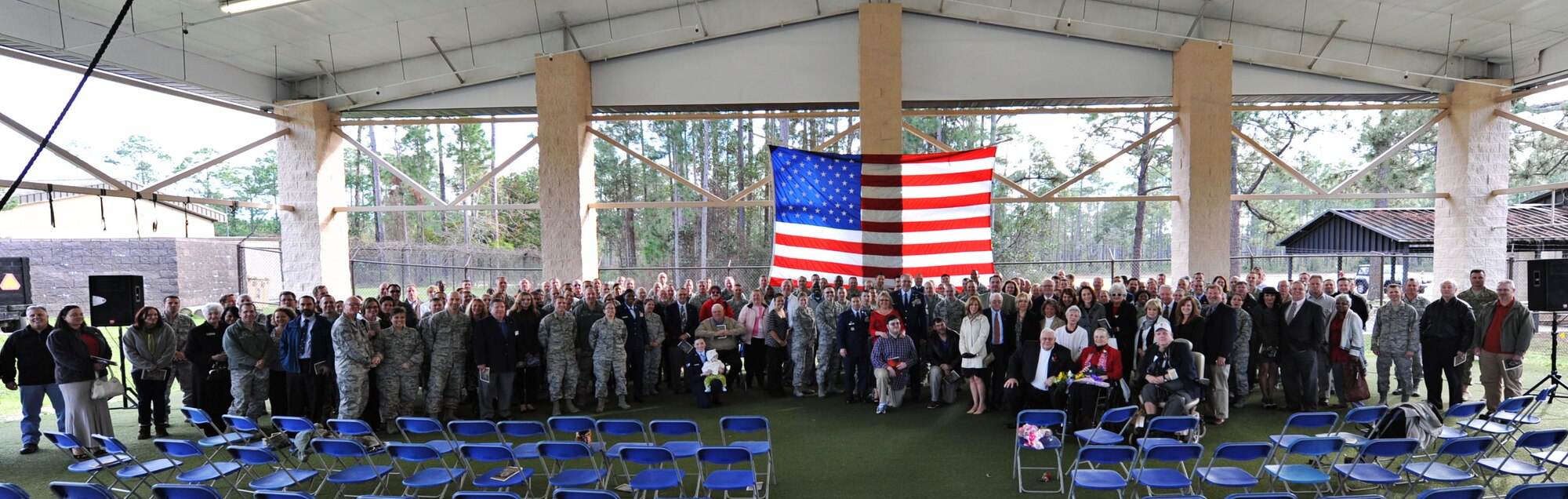 The adopted family of Chief Master Sgt. Francis A. Dailey II, superintendent of 361st Intelligence Surveillance and Reconnaissance Group, gather together for a last photo during his retirement ceremony at Hurlburt Field, Fla, Feb. 14, 2013. Dailey was one of the last active-duty members of the defense aerial gunner career field for the B-52 Stratofortress. (U.S. Air Force photo/Senior Airman Desiree Moye) 