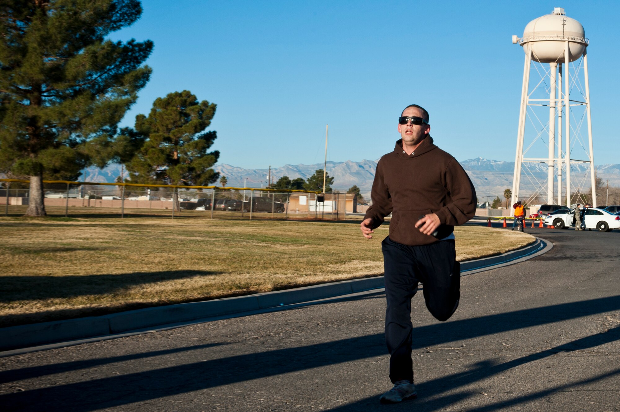 Daniel Champion, 99th Civil Engineer Squadron water and fuel system maintenance technician, finishes  first place during the Valentine’s Day 5-kilometer run Feb. 14, 2013, at Nellis Air Force Base, Nev.  The Warrior Fitness Center organizes 5-kilometer runs throughout the year to promote fitness and health. (U.S. Air Force Photo by Airman 1st Class Jason Couillard)