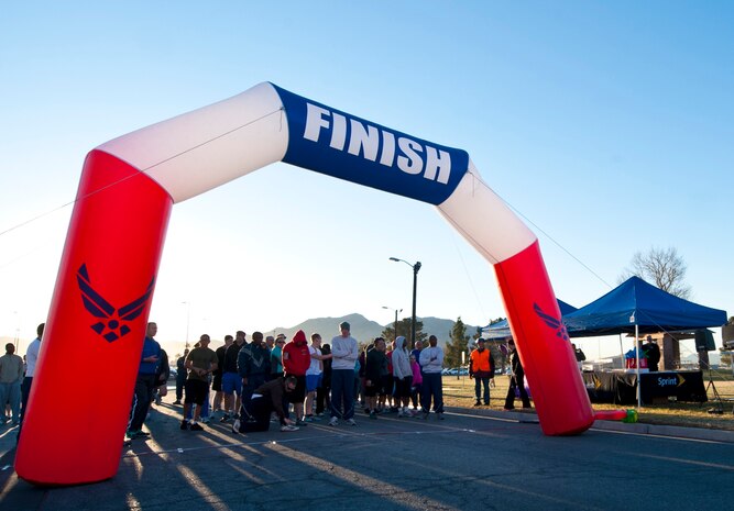 Runners wait for the Valentine’s Day 5-kilometer run outside the Warrior Fitness Center Feb. 14, 2013, at Nellis Air Force Base, Nev.  The Warrior Fitness Center holds a variety of 5-kilometer runs throughout the year including St. Patrick’s Day, July 4th and Air Force birthday runs. (U.S. Air Force Photo by Airman 1st Class Jason Couillard)