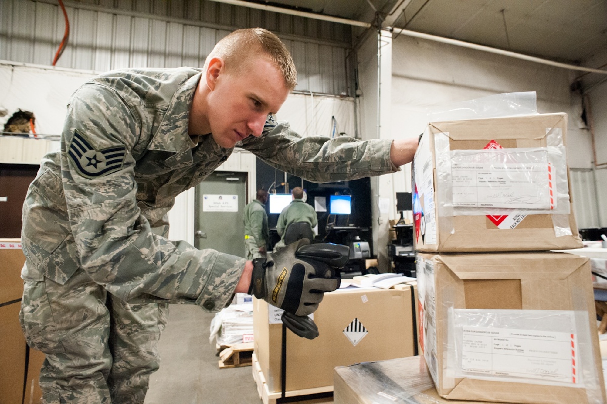 Staff Sgt. Dan Sargent, 305th Aerial Port Squadron special handler supervisor, scans in cargo Feb. 1, 2013, at the aerial port warehouse at Joint Base McGuire-Dix-Lakehurst, N.J. The 305th APS is responsible for all incoming and outgoing cargo movements and preparing hazardous materials for transport. Sargent hails from Beavercreek, Ohio. (U.S. Air Force photo by Russ Meseroll/Released)