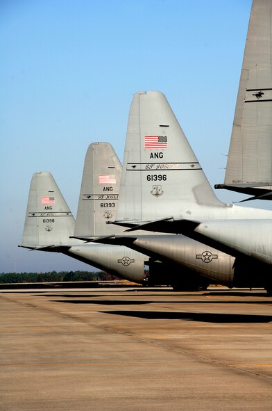 Four Missouri Air National Guard C-130 Hercules cargo aircraft sit on a runway in Savannah, Ga., Nov. 16, 2006. Members of the 139th Airlift Wing participate in an Operational Readiness Exercise. (U.S. Air Force photo by Tech. Sgt. Shannon Bond/Released)