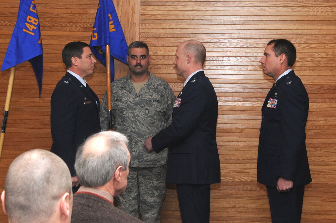 Col. Frank Stokes, 148th Fighter Wing Commander; Senior Master Sgt. Mark Graves, 148FW Operations Group First Sergeant; Col. Gerald Ostern, 148FW Operations Group Commander and Col. Brad Jackson participate in a change of command cereomony on 10 February 2013.  Col Gerald Ostern relinquished command of the Operations Group and Col. Brad Jackson (far right) accepted command during the ceremony which was held at the 148 FW, Duluth, Minn.  (National Guard photo by Senior Airman Sarah Hayes/Released)