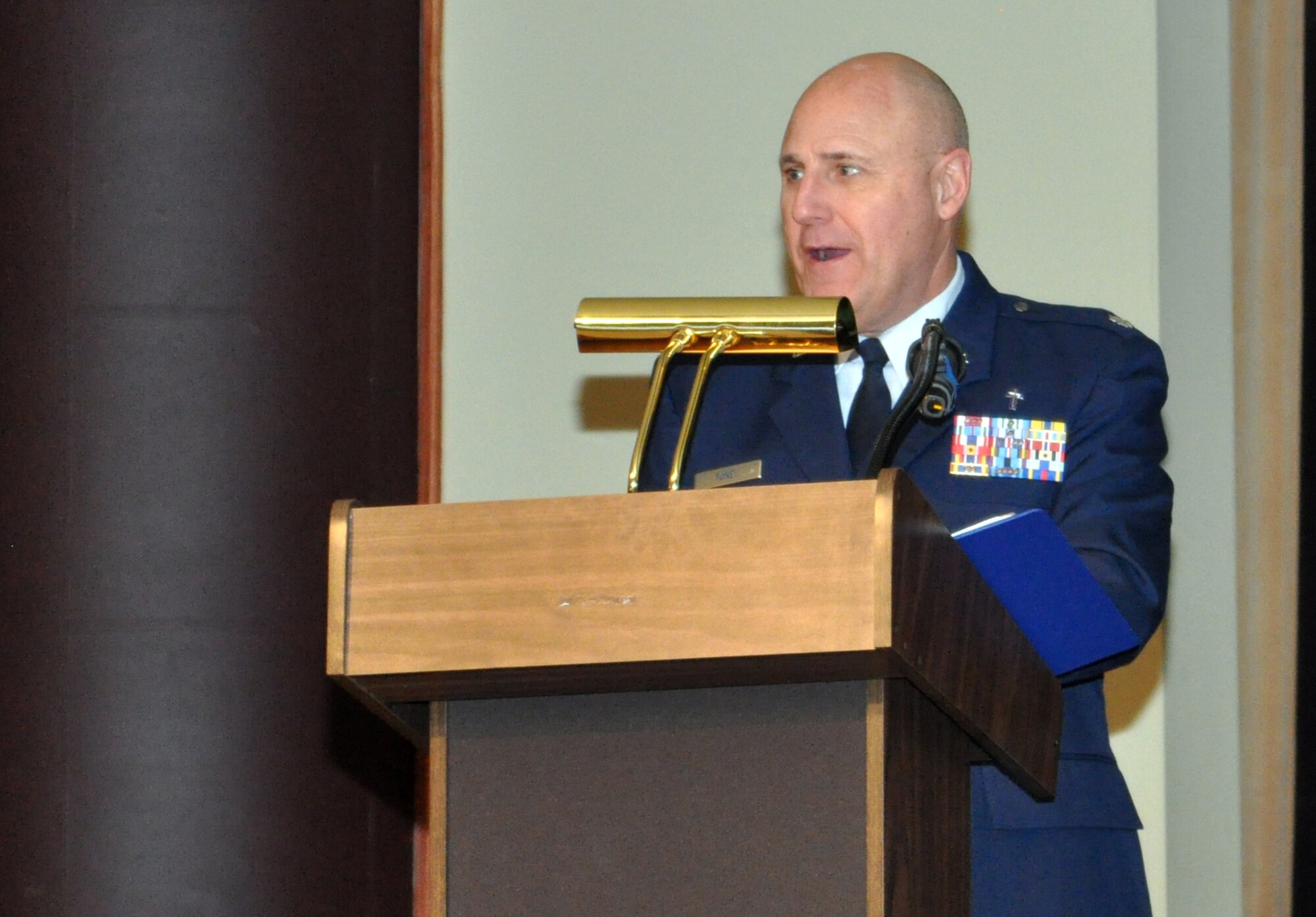 Chaplain (Lt. Col.) Victor Toney, 55th Wing chaplain, shares a few words before providing the invocation at the inaugural Salute to America’s Heroes dinner at the Omaha Ramada Inn Feb. 16. More than 50 wounded warriors and their families from around the Midwest attended the event. (Photo by Ryan Hansen)