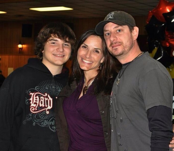 Master Sgt. Jennifer Allara, center, with her son Logan Wayne, left, and her husband Rick Allara. Allara travels to the National Intrepid Center of Excellence in Bethesda, Md., Feb. 25, 2013, seeking treatment for her PTSD and TBI symptoms. (Courtesy Photo) 

