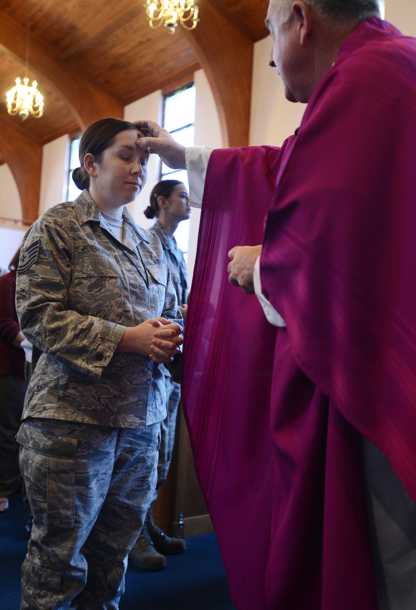 Father Peter Sousa, 20th Fighter Wing Chaplain, places a cross of ashes on members of Team Shaw as part of Ash Wednesday, Shaw Air Force Base, S.C., Feb. 13, 2013. Ash Wednesday represents a time of renewal and repentance. (U.S. Air Force photo by Senior Airman Tabatha Zarrella/Released)
