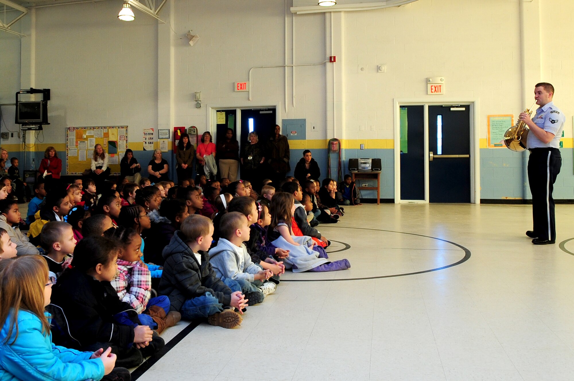 U.S. Air Force Airman 1st Class Daniel Omer, U.S. Air Force Heritage of America Langley Winds woodwind ensemble French hornist, teaches children about his instrument at Meadow Lane Elementary School, Feb. 15, 2013. The Joint Base Langley-Eustis band performed for the elementary students and held a free show for the community the following night. (U.S. Air Force photo/Airman 1st Class Mariah Tolbert/Released)