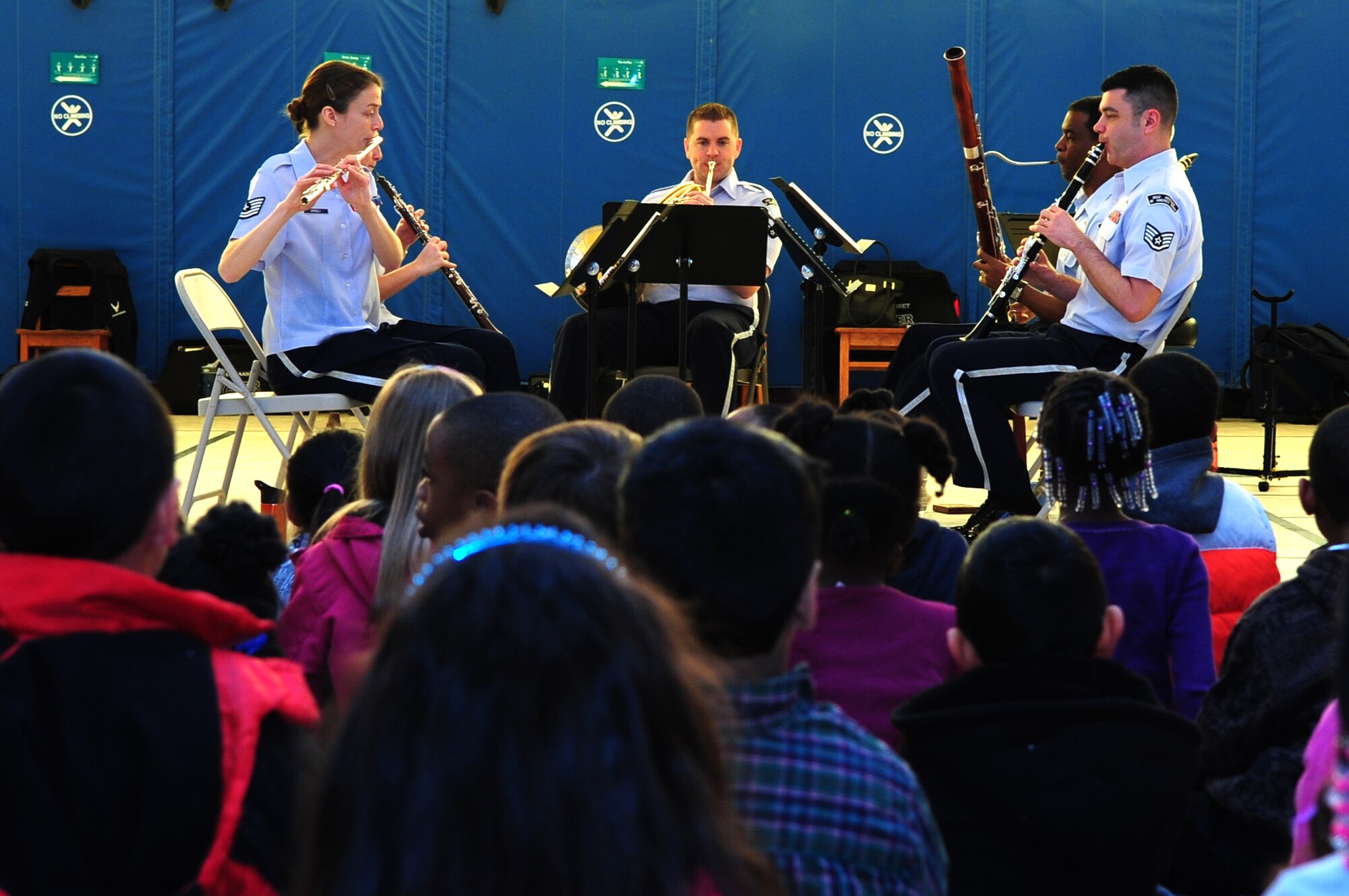 The U.S. Air Force Heritage of America’s Langley Winds woodwind ensemble performs a song as children watch at Meadow Lane Elementary School, Feb. 15, 2013. For over 15 years the ensemble has inspired audiences and enhanced Air Force esprit-de-corps with a broad range of musical performances. (U.S. Air Force photo/Airman 1st Class Mariah Tolbert/Released)