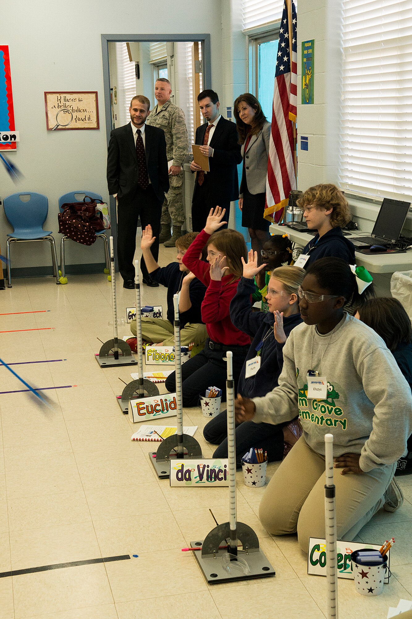 Staff Delegates from Louisiana Congressman John Fleming’s office, Mr. Matthew Silver and Mr. Garth Van Meter, watch kids fire rockets into the air during a tour of STARBASE, Feb. 19, 2013, Barksdale Air Force Base, La. STARBASE presents students with a 25-hour hands-on minds-on Science, Technology, Engineering, and Mathematics curriculum to area 5th grade students and teachers. (U.S. Air Force photo by Master Sgt. Greg Steele/Released)