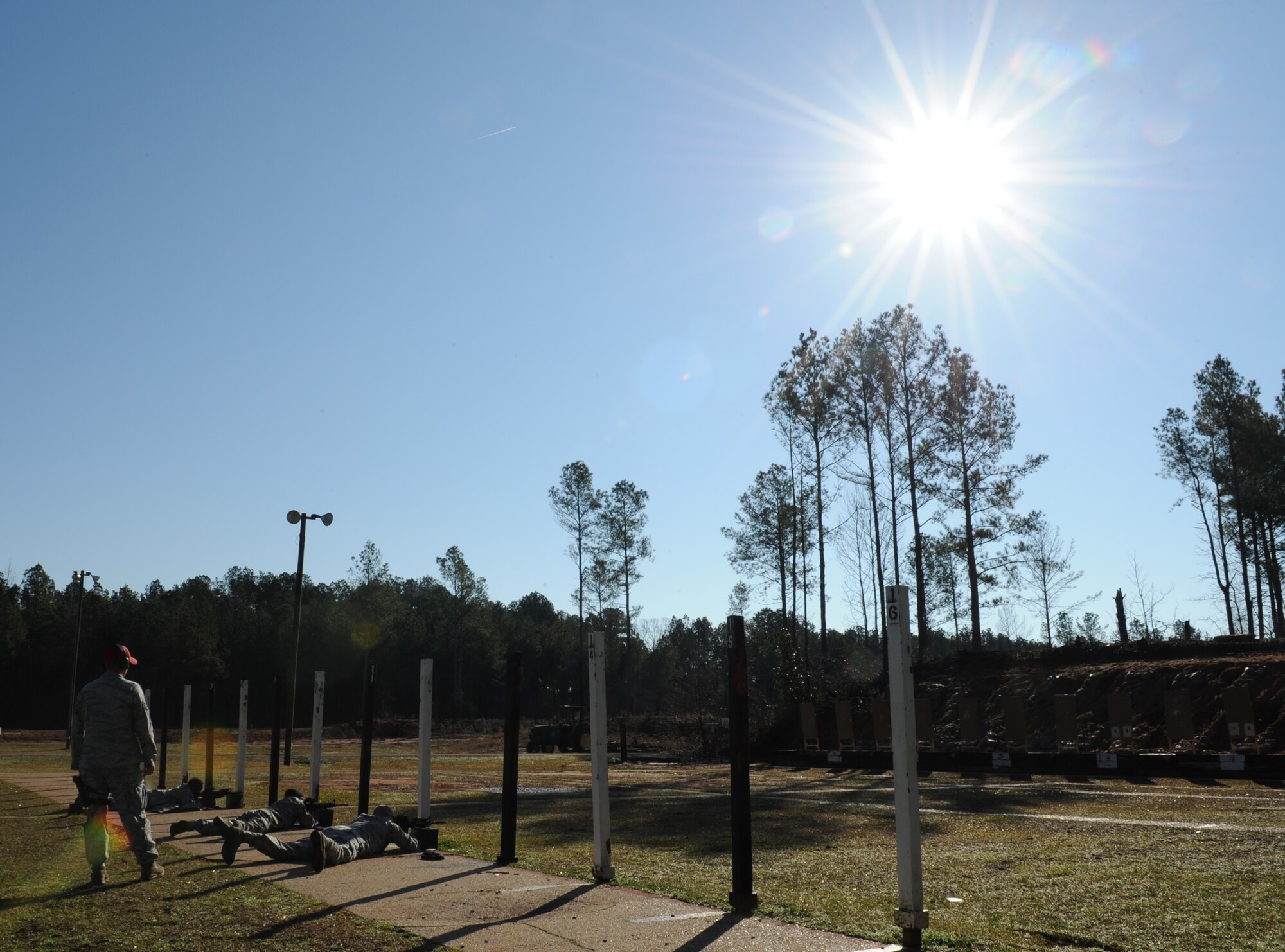 Airmen from the 2nd Security Forces Squadron fire their M4 Carbines at the Bossier Parish Sheriff's Office firing range in Plain Dealing, La., Feb. 14. Security forces Airmen are qualified in various weapons and shooting positions including standing, kneeling and prone. (U.S. Air Force photo/Airman 1st Class Benjamin Gonsier)
