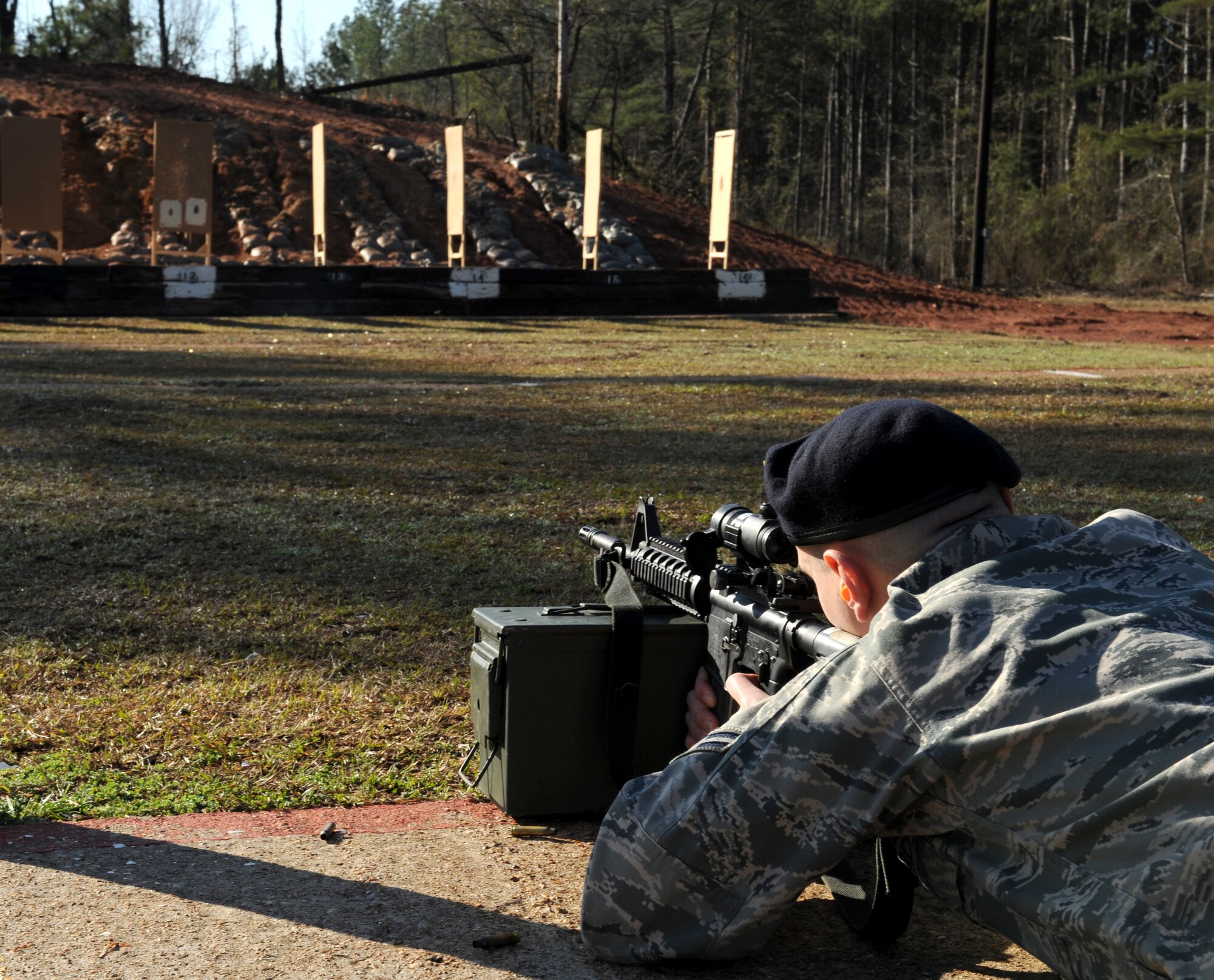 Airman 1st Class Jeremy Traynor, 2nd Security Forces Squadron patrolman, aims an M4 Carbine at a target at the Bossier Parish Sheriff's Office firing range in Plain Dealing, La., Feb. 14. Security forces Airmen are qualified in various weapons and shooting positions including standing, kneeling and prone. (U.S. Air Force photo/Airman 1st Class Benjamin Gonsier)
