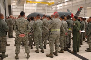 Members of the 13th Reconnaissance Squadron, Beale Air Force Base, Calif.,
gather around leadership at a morning stand-up during the Unit Training
Assembly, Saturday, Feb. 9.  The Reservists received the news that Air Force
Reserve Command had announced the deactivation of the 200-member squadron.
(U.S. Air Force Photo / Dana Lineback)  
