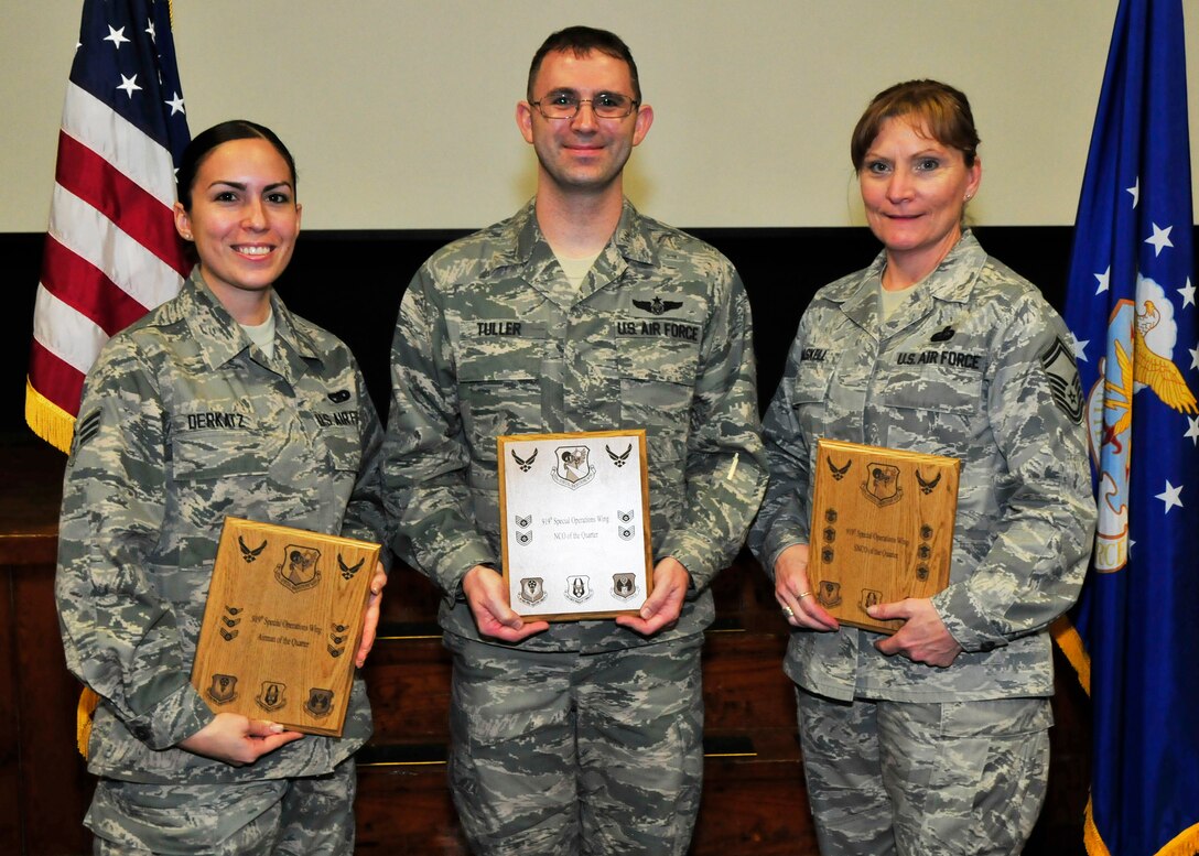 The 919th Special Operations Wing honored its Outstanding Airmen of the Quarter during a recent awards ceremony at Duke Field, Fla.  Air Force reservists earning awards for the fourth quarter of 2012, from left, are:  Senior Airman Melissa Derkatz, Airman of the Quarter, 919th Logistics Readiness Squadron;  Staff Sgt. Daniel Tuller, NCO of the Quarter, 919th Force Support Squadron; and Senior Master Sgt. Julie Haskell, Senior NCO of the Quarter, 919th FSS.  (U.S. Air Force photo/Tech. Sgt. Jasmin Taylor)