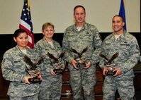 The 919th Special Operations Wing honored its 2012 Outstanding Airmen of the Year in a recent ceremony at Duke Field, Fla.  Posing with their awards, from left, are: Senior Airman Ivette Quinones, Airman of the Year; Master Sgt. Kimberly Perez, First Sergeant of the Year; Senior Master Sgt. Steven Bicknell, Senior NCO of the Year; and Tech. Sgt. Thomas Richardson, NCO of the Year.   2nd Lt. Noel Foster, Company Grade Officer of the Year, was unavailable.  (U.S. Air Force photo/Tech. Sgt. Jasmin Taylor)