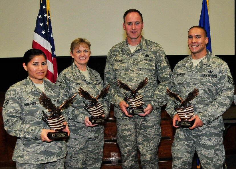 The 919th Special Operations Wing honored its 2012 Outstanding Airmen of the Year in a recent ceremony at Duke Field, Fla.  Posing with their awards, from left, are: Senior Airman Ivette Quinones, Airman of the Year; Master Sgt. Kimberly Perez, First Sergeant of the Year; Senior Master Sgt. Steven Bicknell, Senior NCO of the Year; and Tech. Sgt. Thomas Richardson, NCO of the Year.   2nd Lt. Noel Foster, Company Grade Officer of the Year, was unavailable.  (U.S. Air Force photo/Tech. Sgt. Jasmin Taylor)