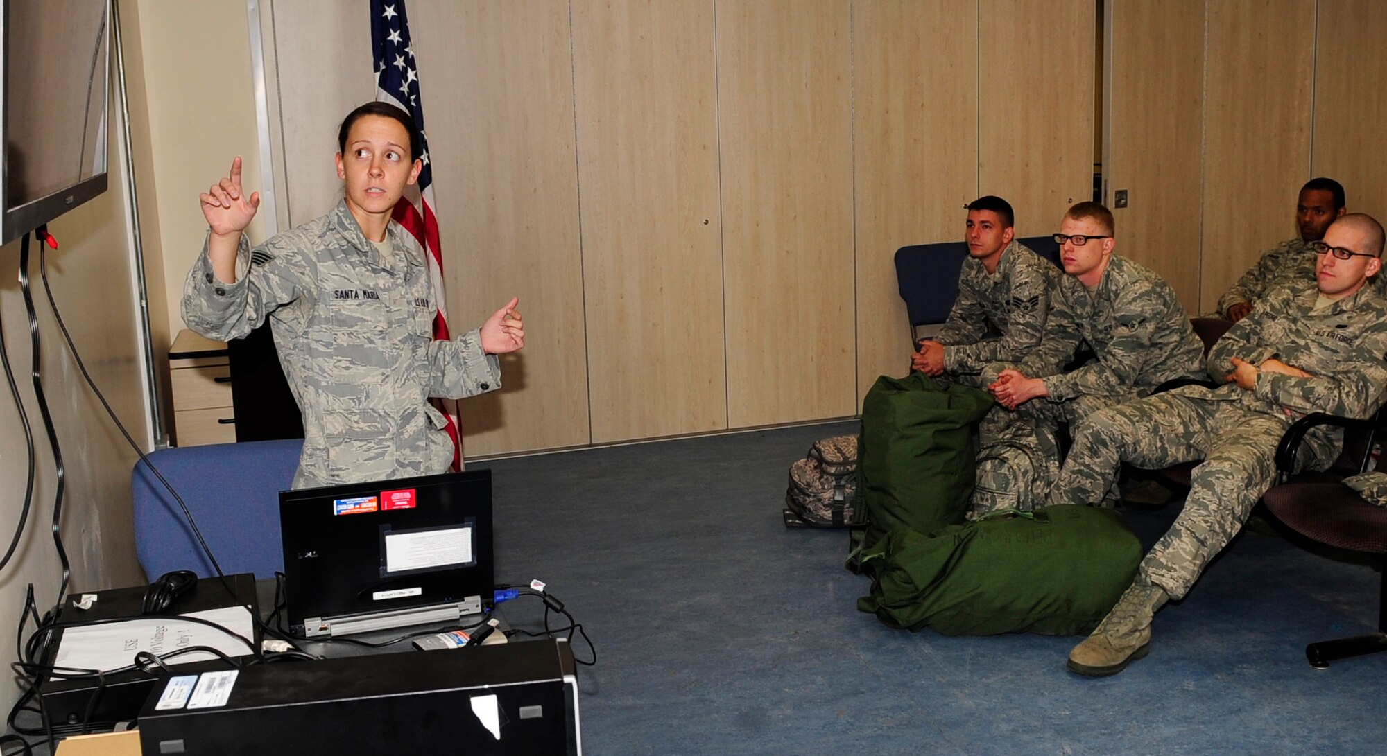 Staff Sgt. Amber Witt, formerly Amber Santa Maria, 100th Operations Group NCO in charge of current intelligence and force protection from Des Moines, Iowa, gives a briefing during a pre-deployment exercise Sept. 7, 2012.(U.S. Air Force photo by Senior Airman Ethan Morgan/Released)