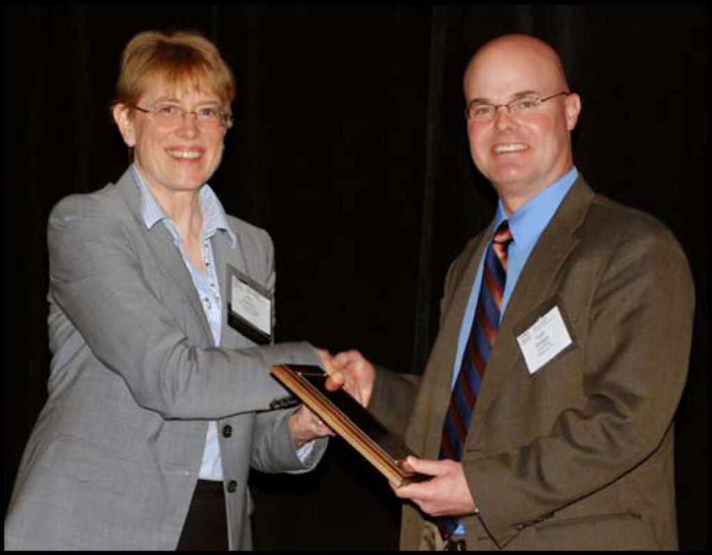 Dr. Ann Bostrum, Society for Risk Assessment
(SRA) president, presents Dr. Todd Bridges with
the 2012 Outstanding Practitioner Award for his
research in risk analysis to support
infrastructure development and operations,
natural resource management and
environmental remediation and restoration.
Bridges, a senior researcher in ERDC-EL,
received the award at the SRA annual meeting in
San Francisco, Calif., in December.