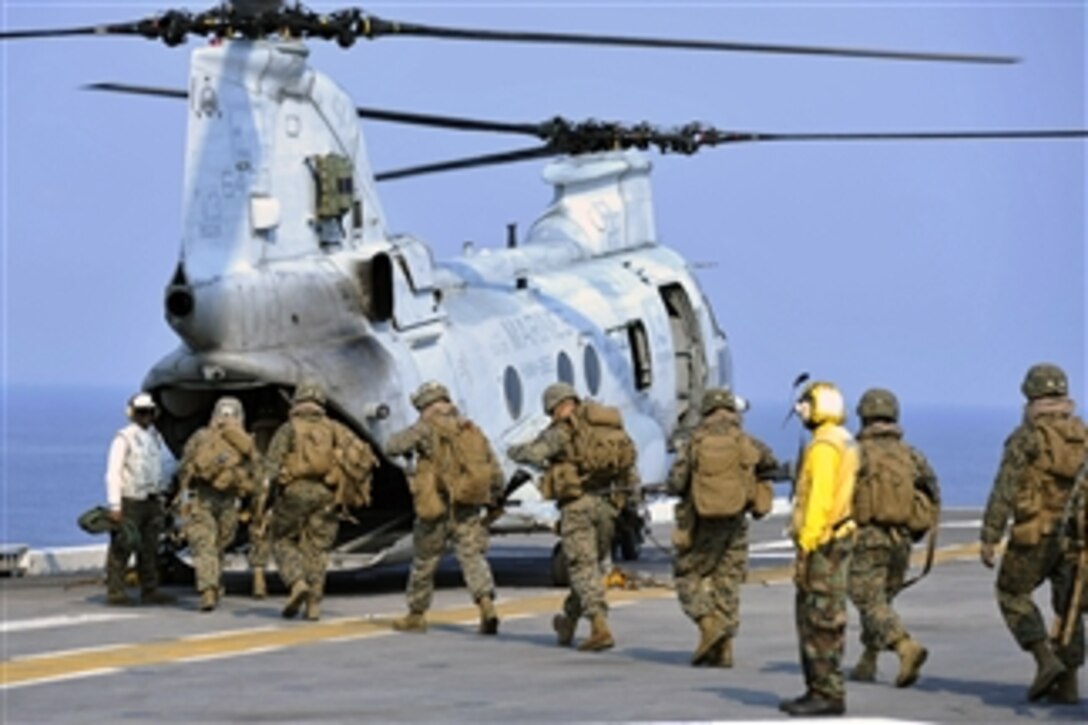 U.S. Marines board a CH-46E Sea Knight helicopter on the flight deck of the amphibious assault ship USS Bonhomme Richard (LHD 6) as the ship operates in the Gulf of Thailand on Feb. 14, 2013.  The Bonhomme Richard Amphibious Ready Group is deployed in the U.S. 7th Fleet area of responsibility and is taking part in Cobra Gold 2013, a Thai-U.S. co-sponsored multinational joint exercise.  
