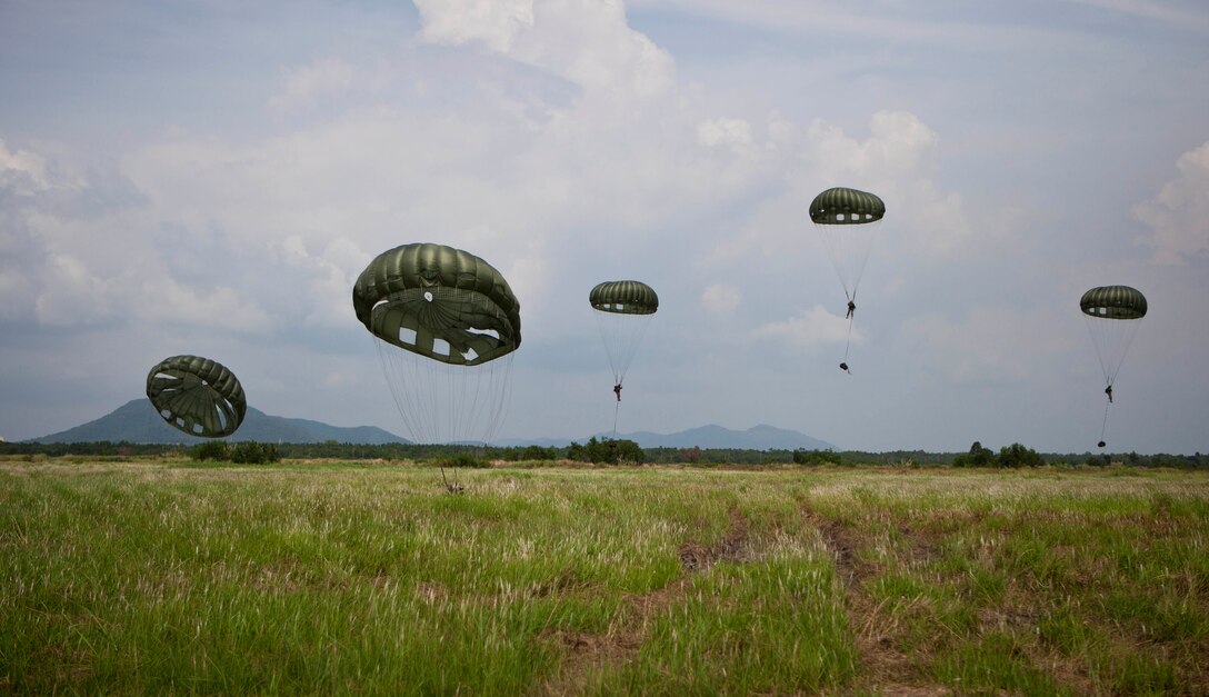 Royal Thai Marines with 1st Long Range Reconnaissance Platoon connect with the ground after parachuting out of a C-130 Hercules during bilateral parachute jump training as part of Cobra Gold 2013 here, Feb. 18. Thailand and the United States are committed to working together in areas of common interest for the stabilization of regional security. The 31st MEU is the only continuously forward-deployed MEU and is the Marine Corps’ force in readiness in the Asia-Pacific region.